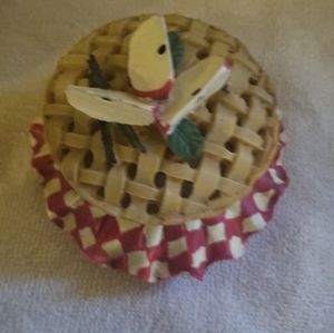 A small ceramic apple pie trinket box with a lattice crust cover